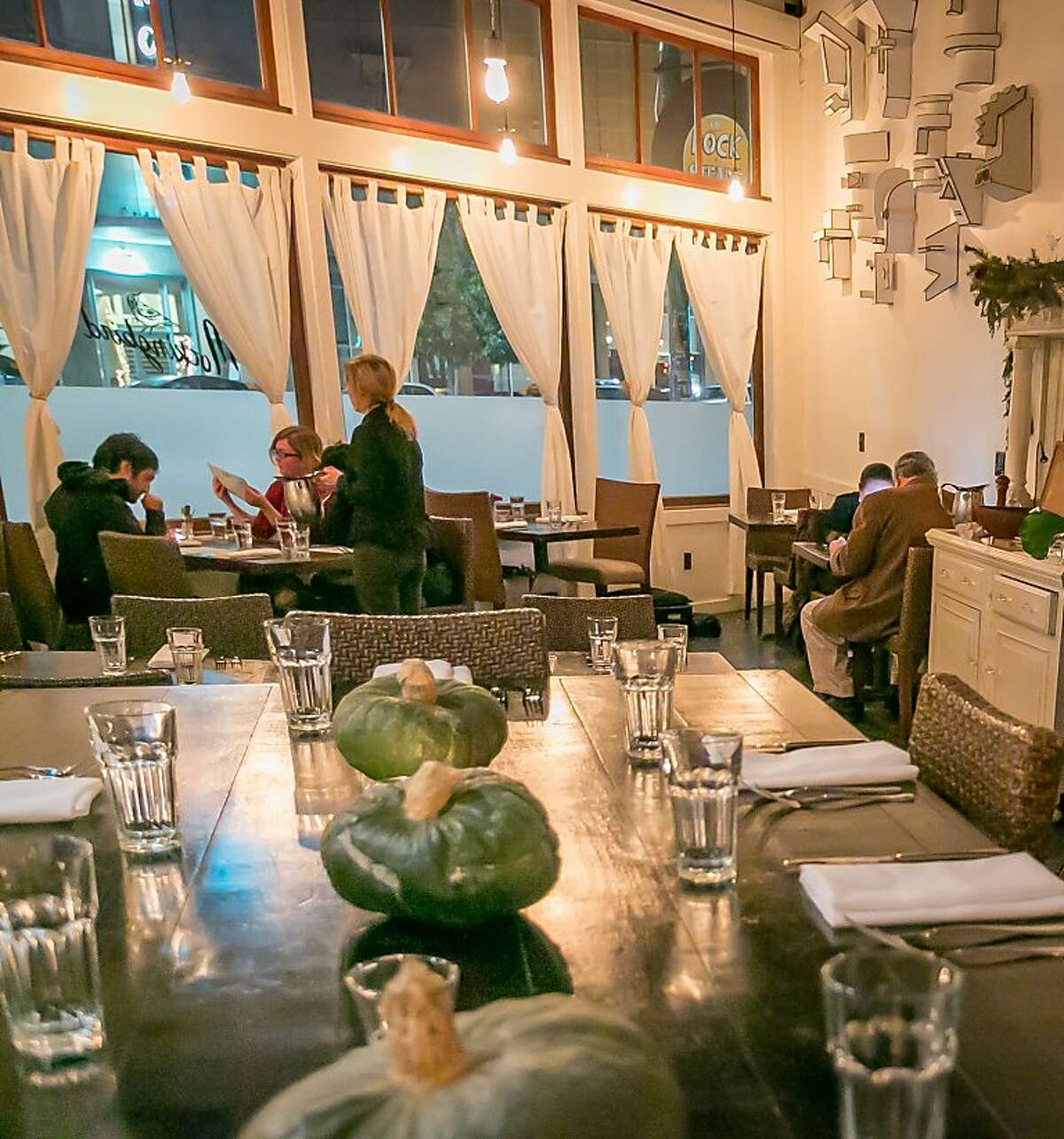 diners enjoy dinner at Mockingbird restaurant in Oakland, Calif., is seen on December 27th, 2013.