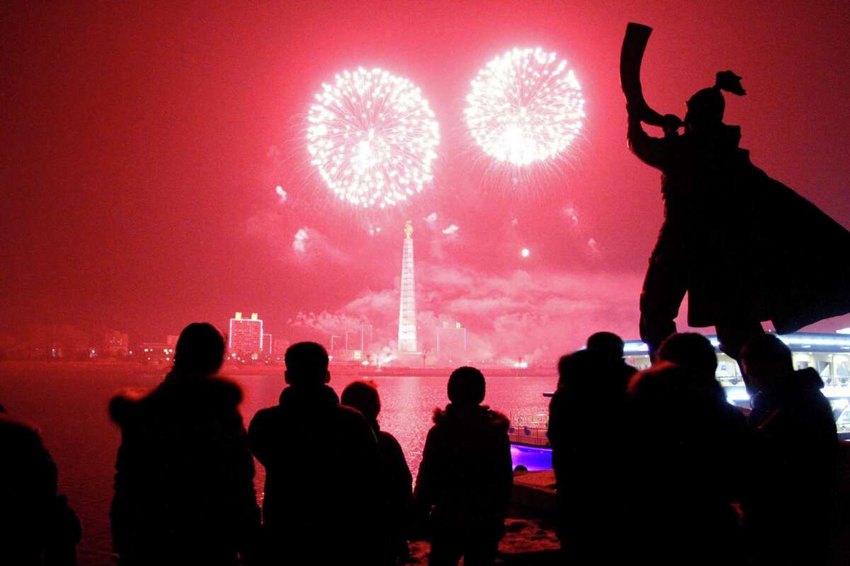 Fireworks explode over Juche Tower and the Taedong River in Pyongyang, North Korea, to celebrate the New Year on Wednesday.