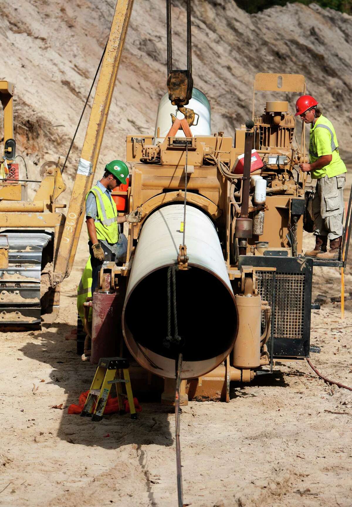 Workers bend a piece of pipe for TransCanada's Keystone XL project in 2012 in Wood County.