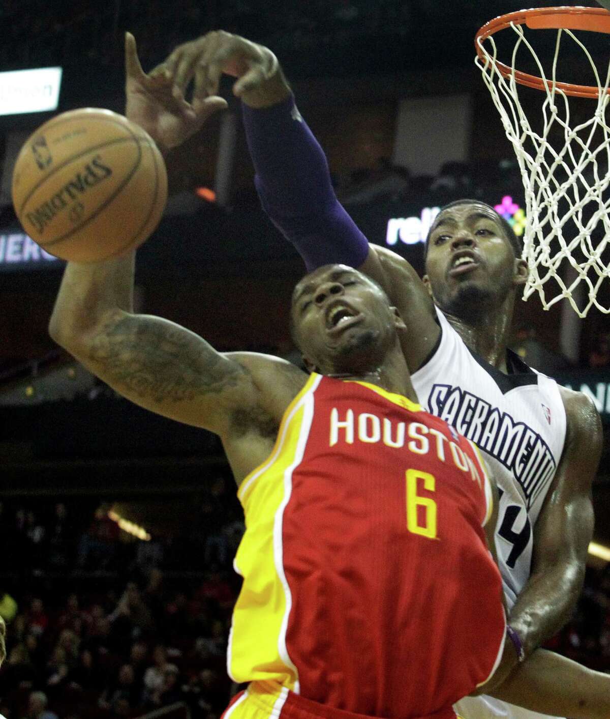 Sacramento's Jason Thompson comes over the top of the Rockets' Terrence Jones (6) to swat the ball away in the first half of the Kings' win Tuesday night.