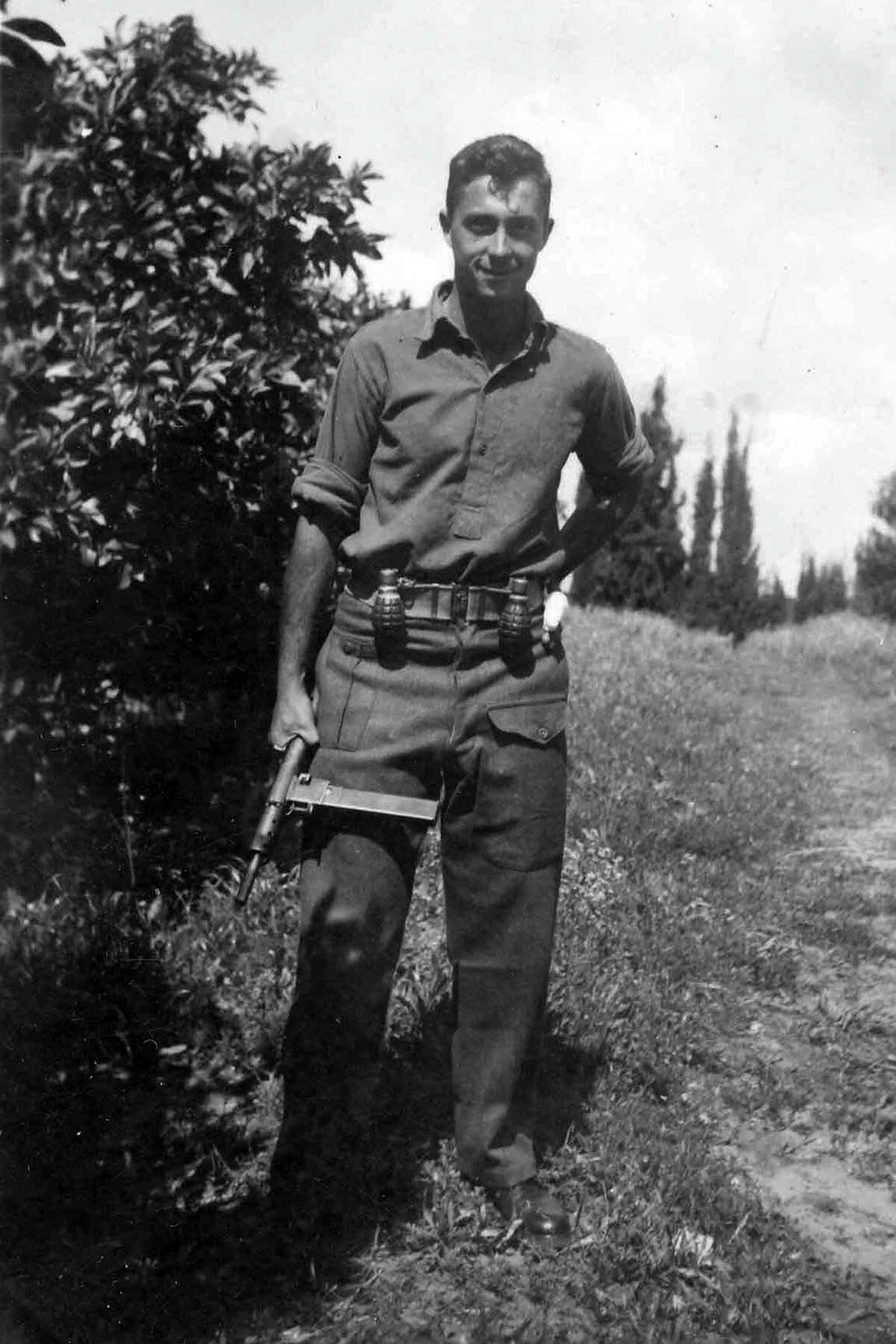 Ariel Sharon holds a Sten gun as a young commander in the Alexandroni Brigade of the fledging Israeli army during the War of Independence in 1948.