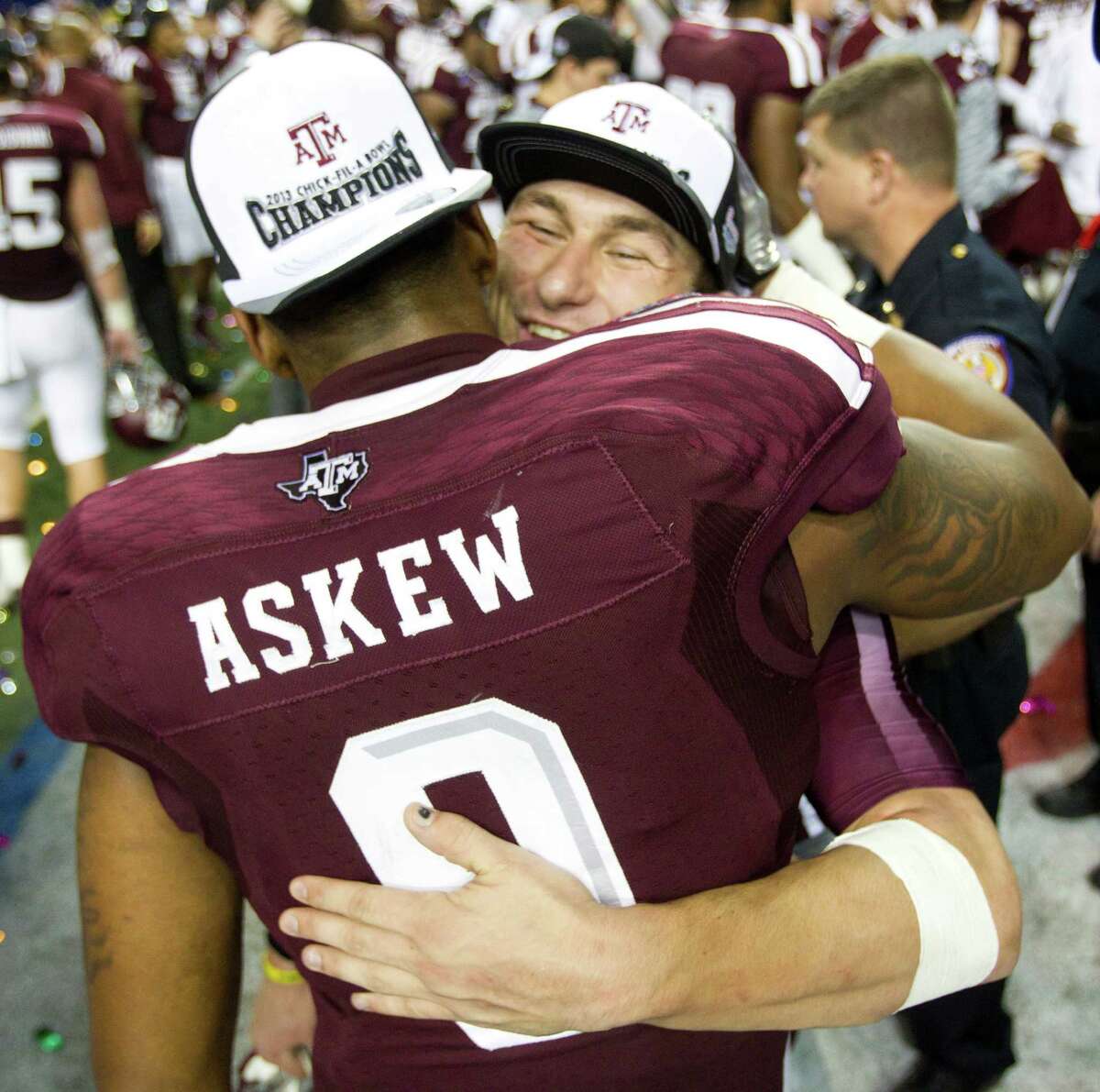 Johnny Manziel, right, and senior linebacker Nate Askew enjoy the Aggies' victory Tuesday night in what was definitely Askew's final college game and probably the finale for the redshirt sophomore quarterback as well.
