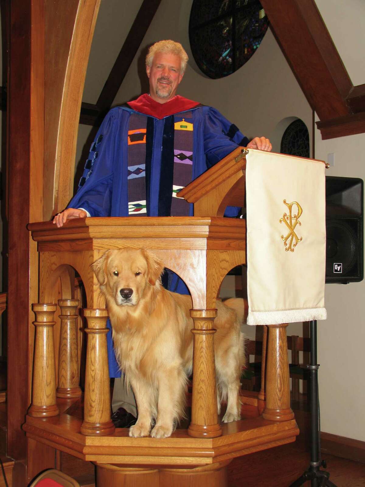 The Rev. William "Bill" Evertsberg is leaving First Presbyterian Church after 17 years. Here, at his pre-Christmas sermon, Everstberg is joined by his loyal golden retriever, Dudley, who assisted Evertsberg during the holidays. ìI took the role of a shepherd at Jesusí nativity,î Evertsberg says, ìwith Dudley playing the role of the faithful sheepdog.î Dudley has also stepped in to play Jesusí donkey on Palm Sunday.