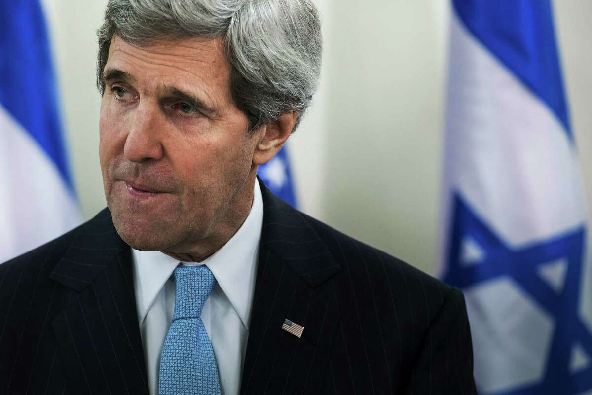 U.S. Secretary of State John Kerry, left, pauses while speaking before a meeting with Israeli Prime Minister Benjamin Netanyahu before a meeting at the prime minister's office in Jerusalem, Thursday, Jan. 2, 2014. Kerry said that finding peace between Israel and the Palestinians is not "mission impossible." (AP Photo/Brendan Smialowski, Pool)
