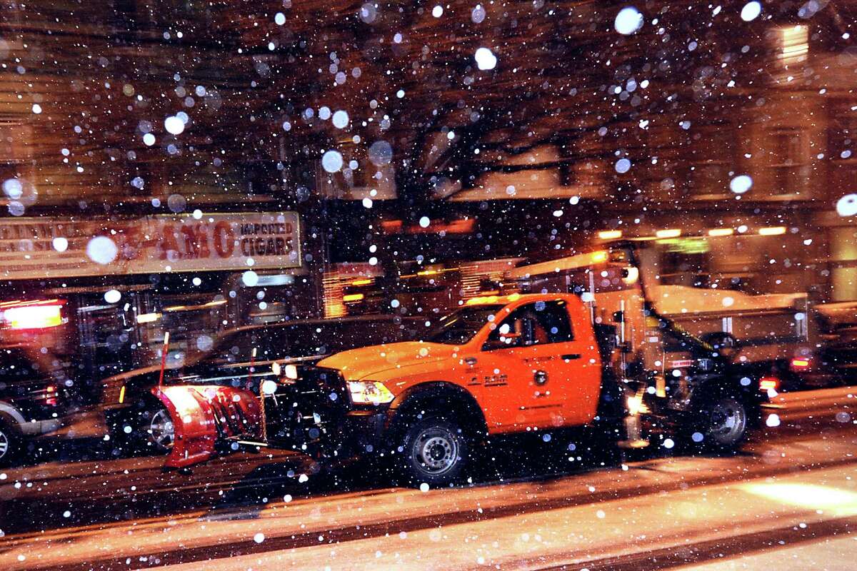 A plow truck on Railroad Avenue during the snow storm that hit Greenwich, Conn., Thursday night, Jan. 2, 2014.