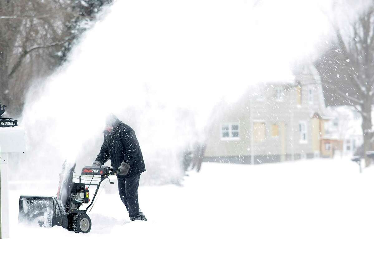 Residents start to dig out after an overnight snow storm in Fairfield, Conn. on Friday, Jan. 3, 2014.