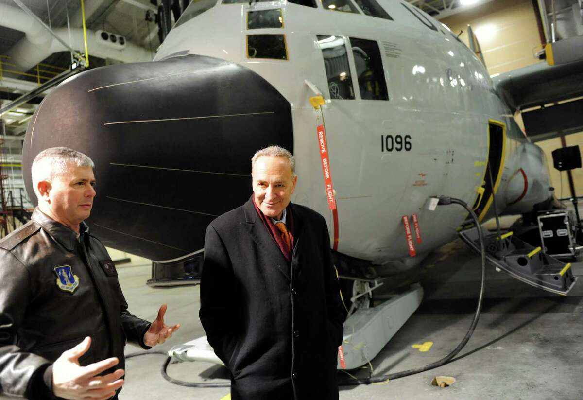 Sen. Chuck Schumer, left, examines a ski-equipped LC-130 aircraft at the 109th Airlift Wing with Col. Shawn Clouthier on Friday, Jan. 3, 2014, at Stratton Air National Guard Base in Scotia, N.Y. Schumer toured the base and vowed to fight to maintain current levels of funding from the National Science Foundation. (Cindy Schultz / Times Union)