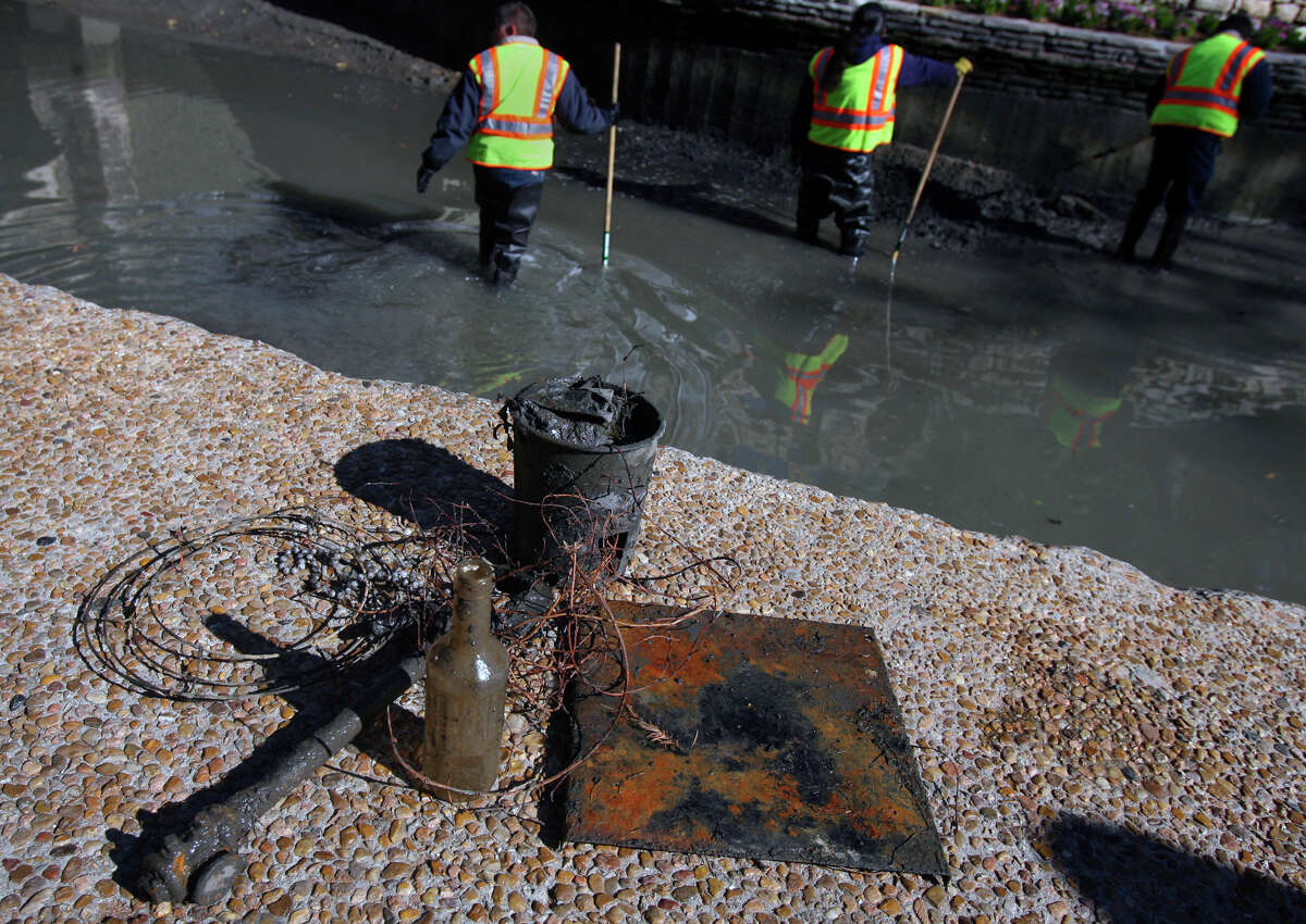 THE FOLLOWING ARE PHOTOS OF DEBRIS FOUND WHEN THE RIVER WAS DRAINED IN PREVIOUS YEARS.  Debris removed from the San Antonio River has been placed on a walkway at the Arneson River Theater Monday as workers from the City of San Antonio's Downtown Operations Department work to remove sediment from the sides of the walls of the river while it is being drained. Pipes, wires bottles and buckets are just a few of the things workers have been finding in the river. JOHN DAVENPORT/jdavenport@express-news.net