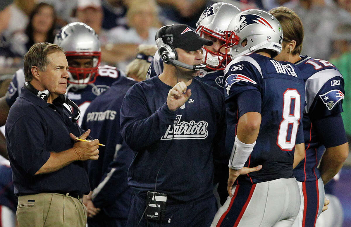 As the Patriots' offensive coordinator in 2011, Bill O'Brien, center, was in his element - coaching where he grew up.