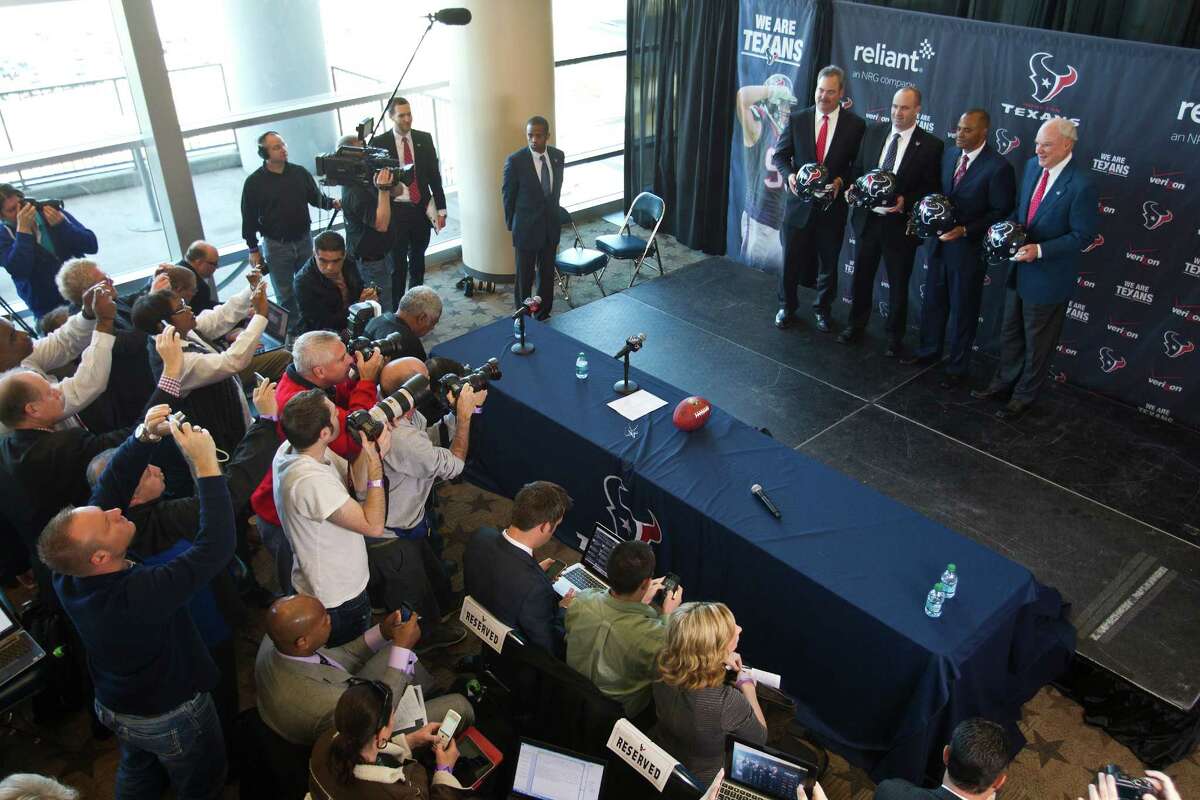 The media gets its first collective glimpse of the Texans' new head coach, Bill O'Brien, second from left on the stage, during Friday's new conference at Reliant Stadium. O'Brien, 44, cut his teeth in the coaching ranks over an 86-mile swath of New England.