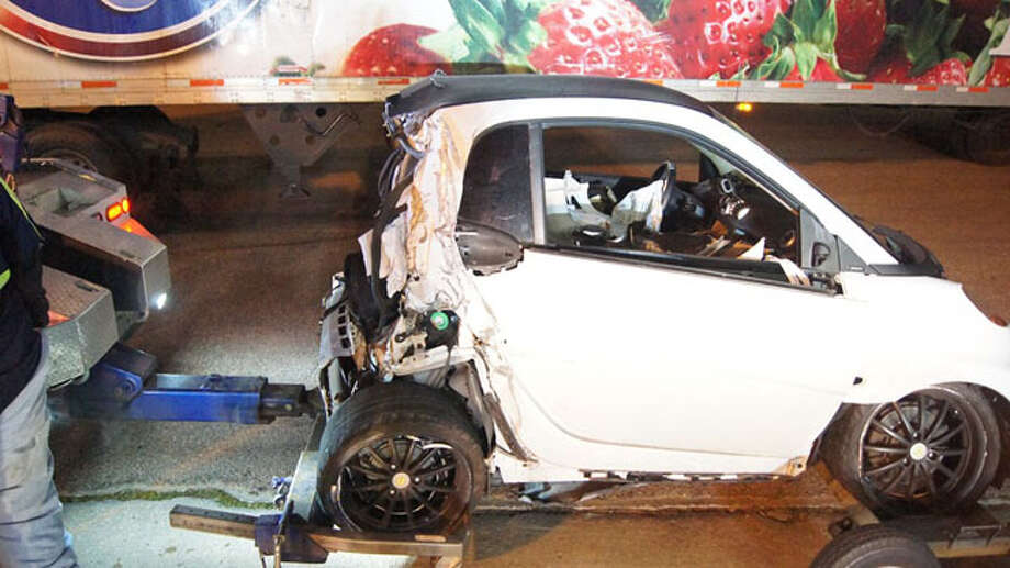 Smart Car Crushed By 18 Wheeler Houston Chronicle The Driver Of A Smart Car Is In Critical Condition Today After An