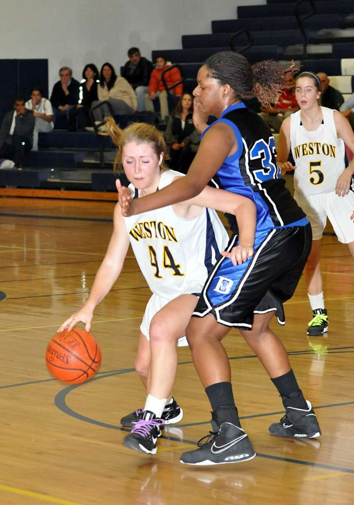 Weston's Brittany Swanson dribbles past Bunnell's Ishede Milfort during Tuesday's game at Weston.