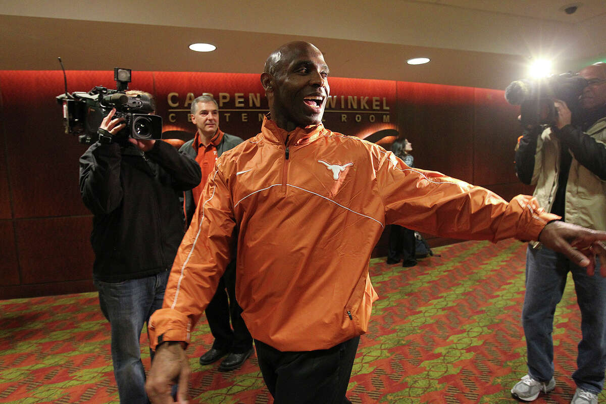 University of Texas Head Football Coach Charlie Strong leaves a staff meeting before a press conference at the campus in Austin, Monday, Jan. 6, 2014. Strong, 53, formerly Louisville coach, took the job Sunday night replacing Mack Brown.