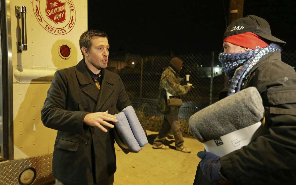 The Salvation Army staff was giving out blankets, hot drinks and offering rides to shelters to the homeless stuck in the cold.
