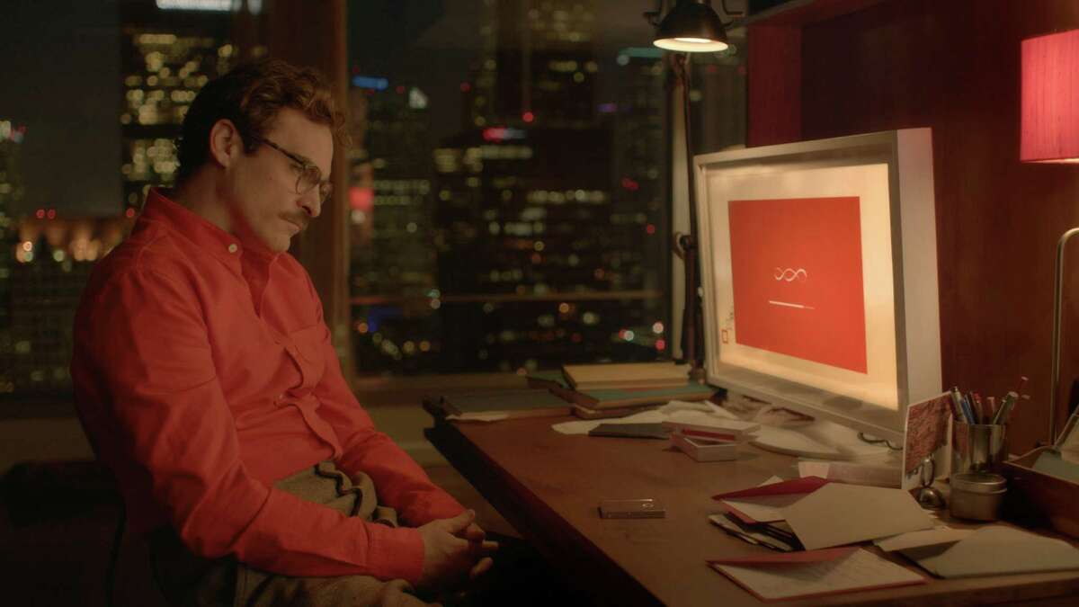 Theodore (Joaquin Phoenix) develops an emotional connection with his computer operating system in "Her."