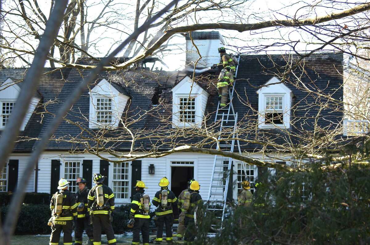 Darien and Noroton Heights firefighters responded to a structure fire at 261 Hollow Tree RIdge Road on Wednesday, Jan 8, 2014, in Darien, Conn.