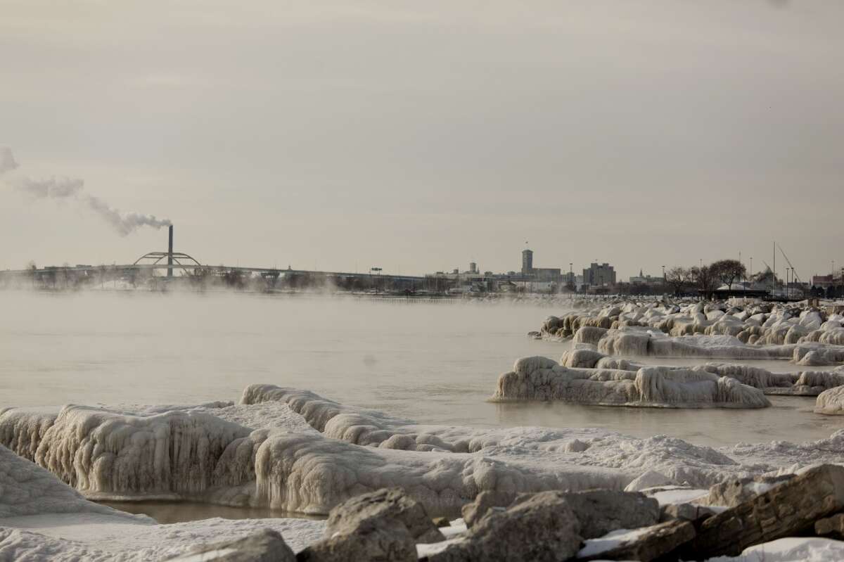 Steam rises off the water along the icy shore of Lake Michigan as temperatures remain in the negative digits on Jan. 7, 2014 in Milwaukee, Wis. A 'polar vortex' of frigid air centered on the North Pole dropped temperatures to the negative double digits at its worst. (Photo by Darren Hauck/Getty Images)