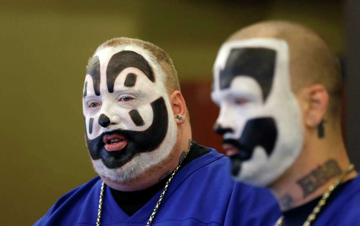 Joseph Bruce aka Violent J, left, and Joseph Utsler aka Shaggy 2 Dope, members of the Insane Clown Posse address the media in Detroit, Wednesday, Jan. 8, 2014. The rap metal group sued the U.S. Justice Department on Wednesday over a 2011 FBI report that describes the duo's devoted fans, the Juggalos, as a dangerous gang, saying the designation has tarnished their fans' reputations and hurt business. The American Civil Liberties Union filed the lawsuit in Detroit federal court on behalf of the group's two members. (AP Photo/Carlos Osorio)