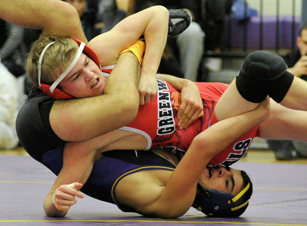 Greenwich's Jack Benenson wrestles Westhill's Matthew Conte in the 120-pound weight class during their wrestling match at Westhill High School in Stamford, Conn., on Thursday, Jan. 9, 2013.