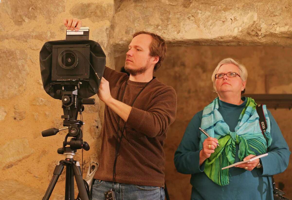 UTSA graduate student architecture major Chris Haskell, 33, (left) and UTSA Director of the Center for Architectural Engagement Sue Ann Pemberton prepare to photograph a section of the sacristy room inside the Alamo shrine Thursday Jan. 9, 2014.