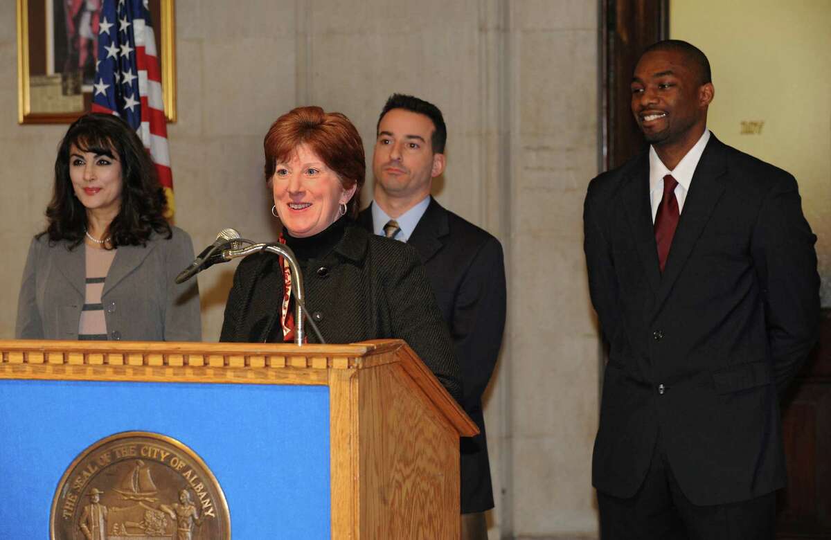 Mayor Kathy Sheehan announces the first round of staff appointments and nominations for commissioners for the City of Albany at City Hall on Friday, Jan. 10, 2014, in Albany, N.Y. Standing with mayor Sheehan is Ismat Alam, left, who was named as Budget Director, Daniel Mirabile, center, who was nominated as Commissioner of the Department of General Services and Jonathan Jones, right, who was nominated as Commissioner of the Department of Recreation, Youth and Workforce Services. (Lori Van Buren / Times Union)