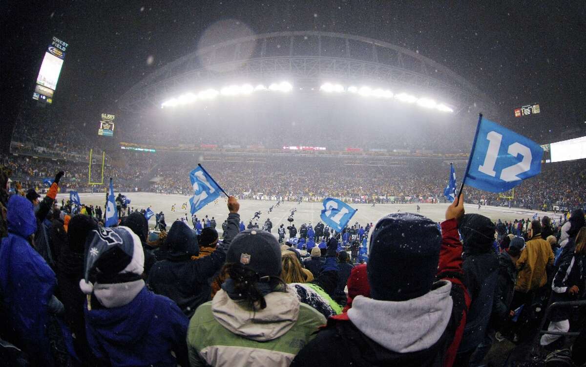 Seattle Seahawks fans wave 12th Man flags during the opening kickoff of a snowy Monday Night Football game between the Green Bay Packers and the Seattle Seahawks at Qwest Field in Seattle on Nov. 27, 2006.