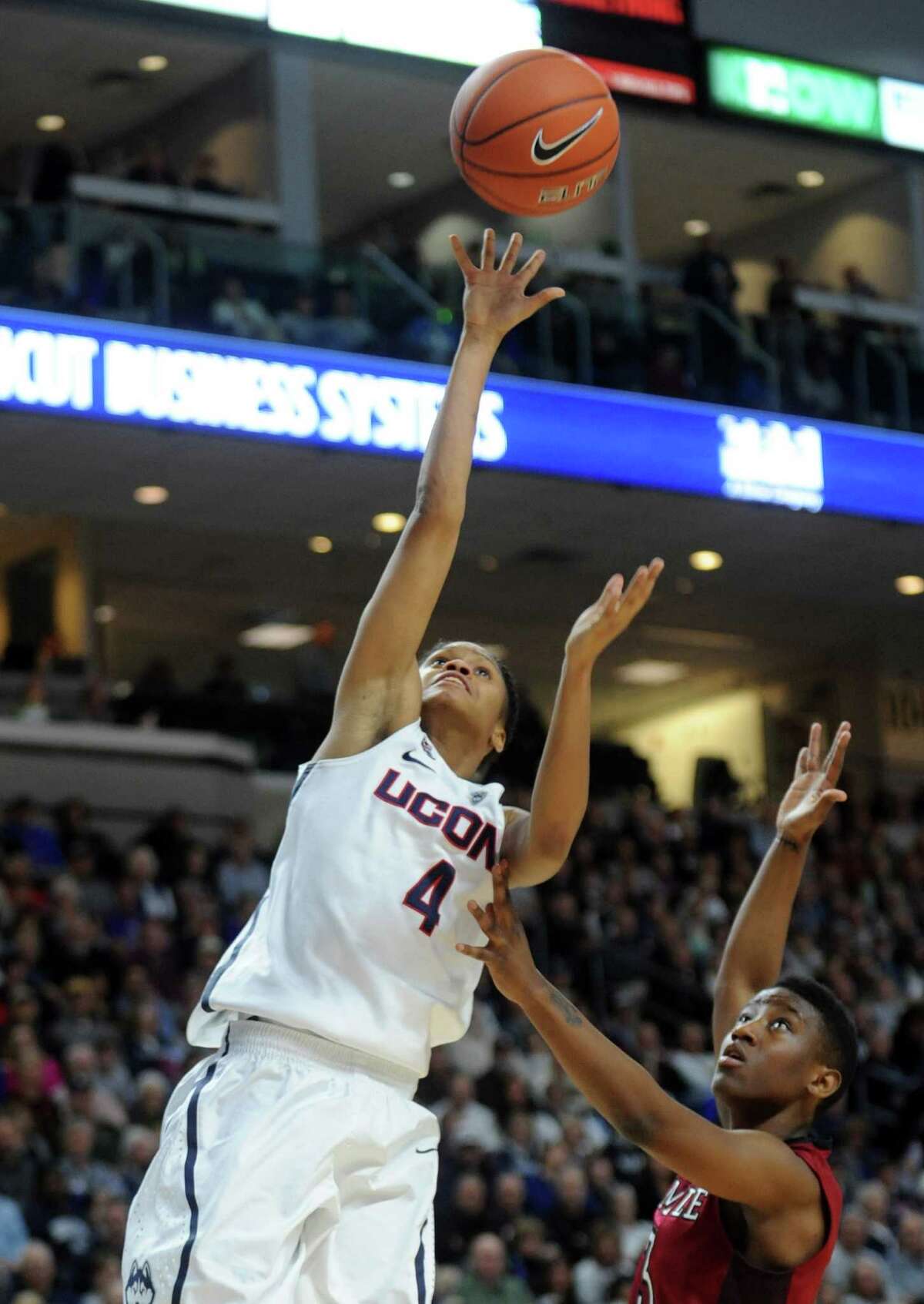 University of Connecticut's Moriah Jefferson goes in for the layup as Temple's Rateska Brown defends during their game Saturday, Jan. 11, 2014 at the Webster Bank Arena in Bridgeport, Conn.