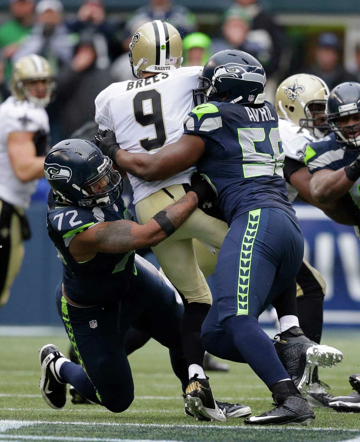 Seattle Seahawks defensive end Cliff Avril (56) celebrates after sacking  New Orleans Saints quarterback Drew Brees during the third quarter of an  NFC divisional playoff NFL football game in Seattle, Saturday, Jan.