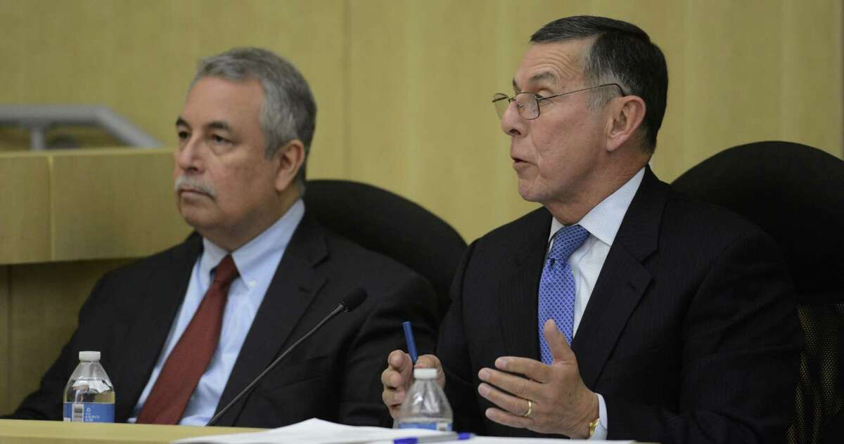 South San ISD's interim superintendent Abelardo Saavedra, right, attends a meeting on Thursday, Jan. 9, 2014. Attorney Pablo Escamilla sits at left.
