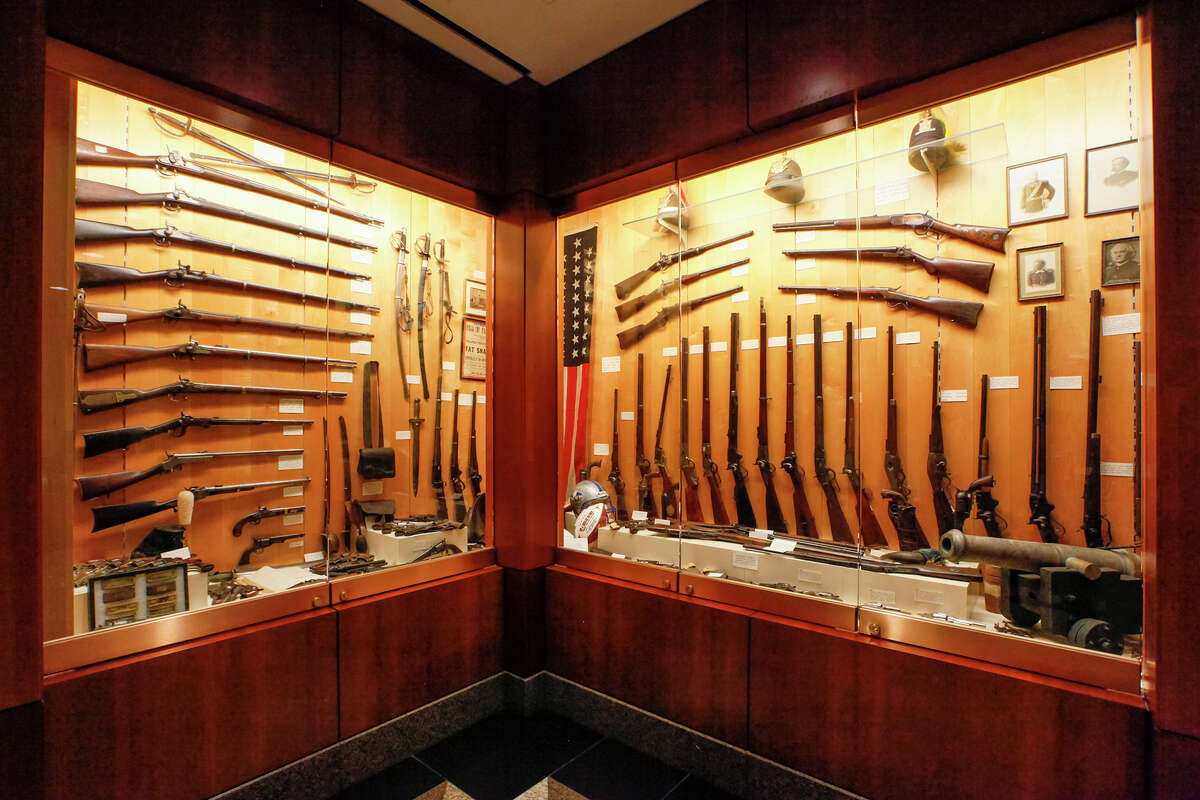 A collection of rifles and other artifacts owned by B.J. "Red" McCombs on display on the first floor of McCombs Plaza at 755 E. Mulberry on Friday, Jan. 10, 2014. Photo by Marvin Pfeiffer / Prime Time Newspapers