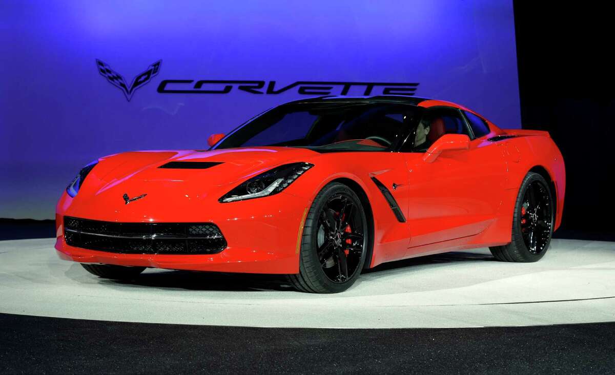 In this Monday, Jan. 14, 2013, file photo, the 2014 Chevrolet Corvette Stingray is revealed at media previews for the North American International Auto Show in Detroit. The Chevrolet Corvette Stingray has been named North American Car of the Year at the North American International Auto Show. The truck of the year is the Chevrolet Silverado. (AP Photo/Paul Sancya, File)