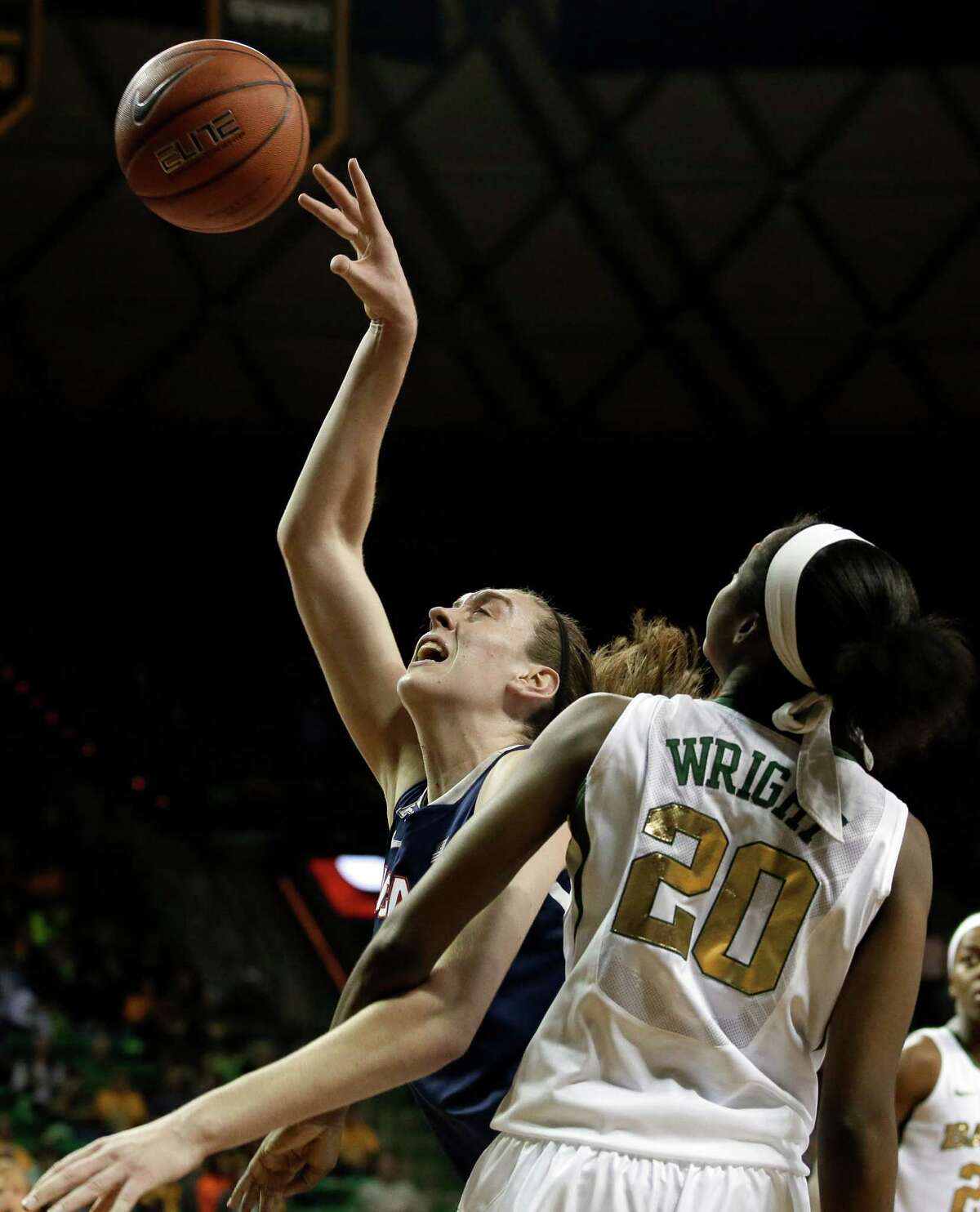 Connecticut's Breanna Stewart, left, fights her way to a shot opportunity against Baylor's Imani Wright (20) in the first half of an NCAA college basketball game, Monday, Jan. 13, 2014, in Waco, Texas.