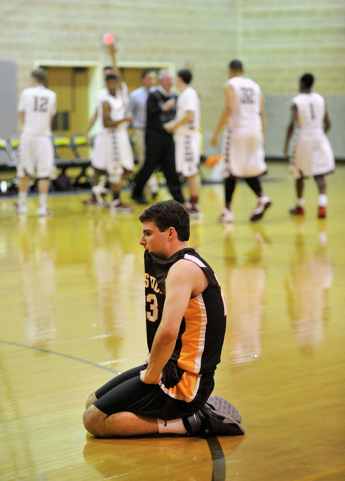 Brunswick's Billy O'Malley reacts after losing to Hopkins, 60-58, in the final seconds of their basketball game at Brunswick School's Simpson Athletic Center in Greenwich, Conn., on Monday, Jan. 13, 2014.
