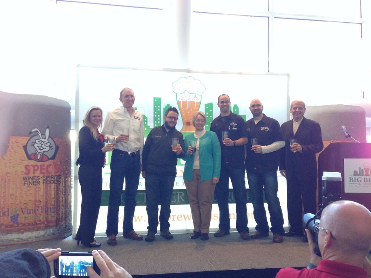 Several local craft brewers were on hand for the Big Brew announcement today at the George R. Brown Convention Center. From left, Lisa Rydman of event sponsor Spec's, Brock Wagner of Saint Arnold, David Graham of Karbach, Mayor Annise Parker, Brian Royo of No Label, Carl Norberg of Fort Bend Brewing and Clifton McDerby of Food & Vine Time Productions.