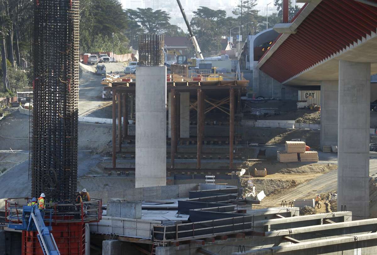 Construction work (lower left) on a column for northbound lanes of the Presidio Parkway continues in San Francisco, Calif. on Tuesday, Jan. 14, 2014. With three major transportation projects wrapping up last year, the rebuilding of the route to the Golden Gate Bridge is among the few still underway.