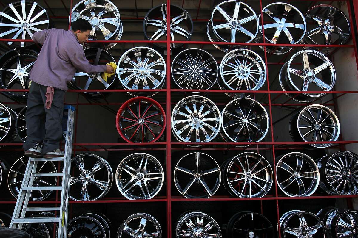 Jaime Rodriguez, 28, polishes tire rims while working at San Pablo Tires & Wheels Auto Center January 15, 2014 in San Pablo, Calif. Rodriguez, who lives in the area, says the business has been around for a little over three years. According to latest demographic data, Latinos are expected to soon replace Caucasians as the biggest ethnic group in California.