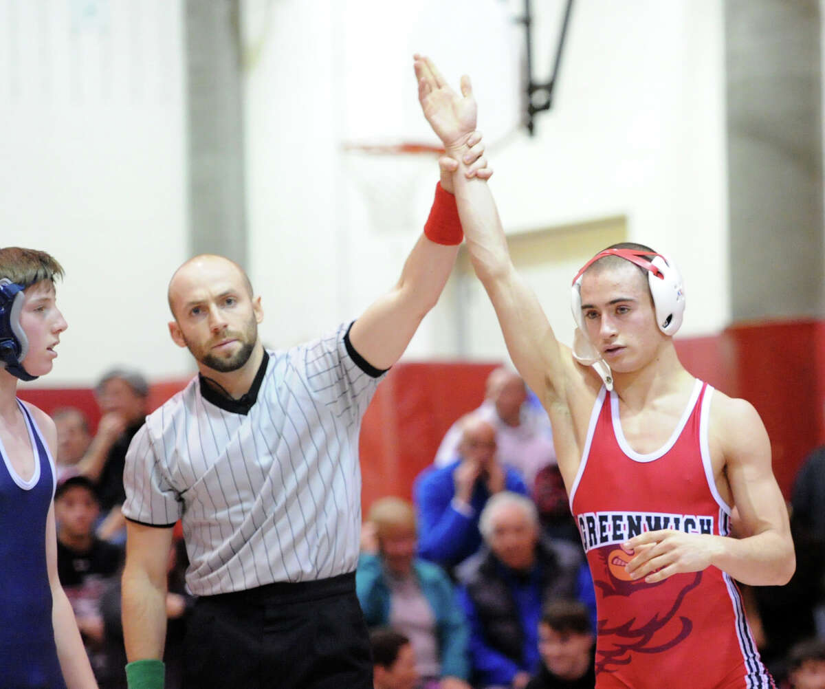 Clarke wrestling pins down Page in season opener