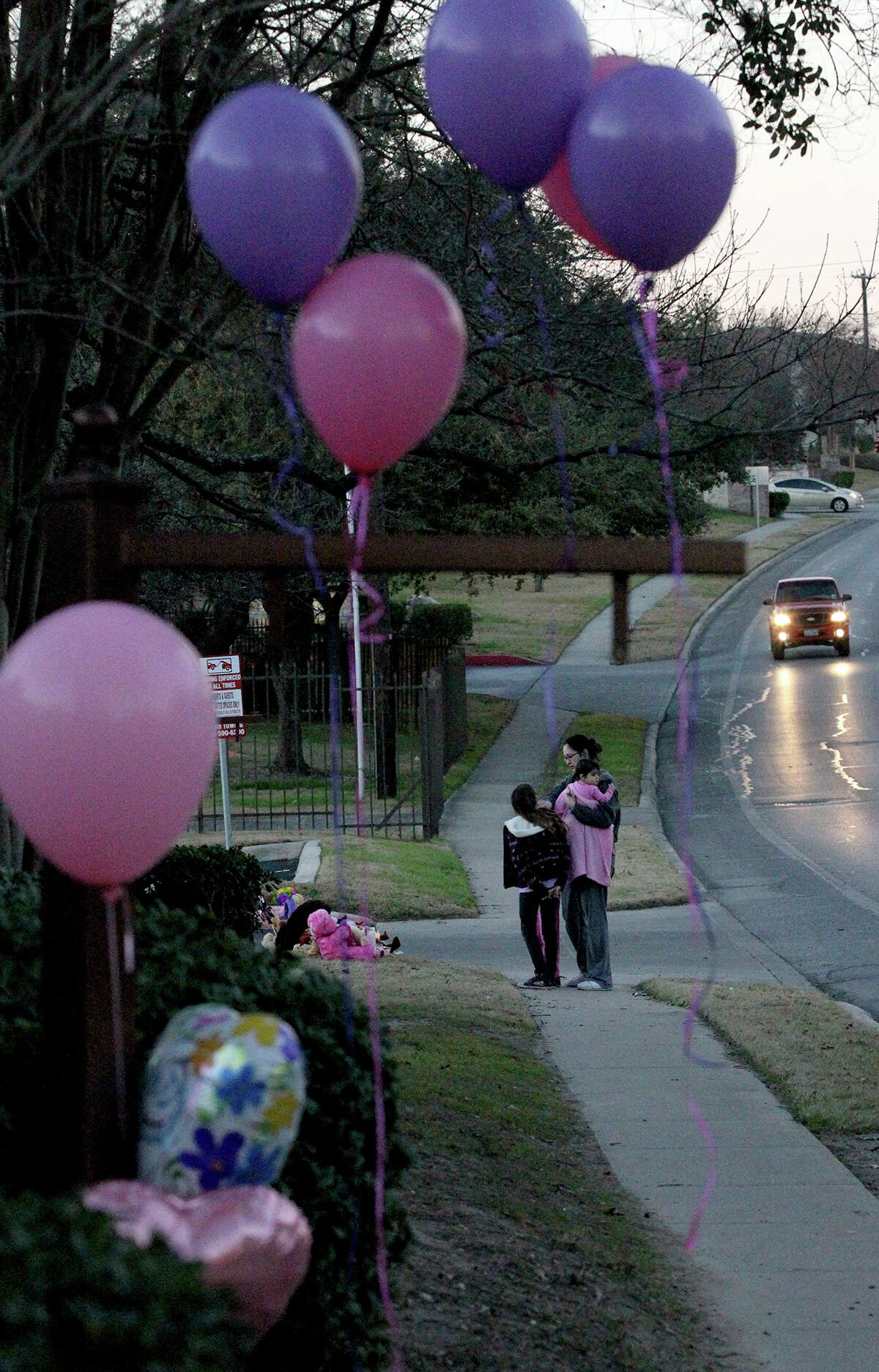 Monica Bloompott visits an area with her children Thursday January 16, 2014 where Tatyana Babineaux, 9, was killed yesterday on the 11,700 block of Braesview after being hit by a truck. Babineaux was walking to Larkspur Elementary about 7:00 am. when she was struck by the hit-and-run driver.