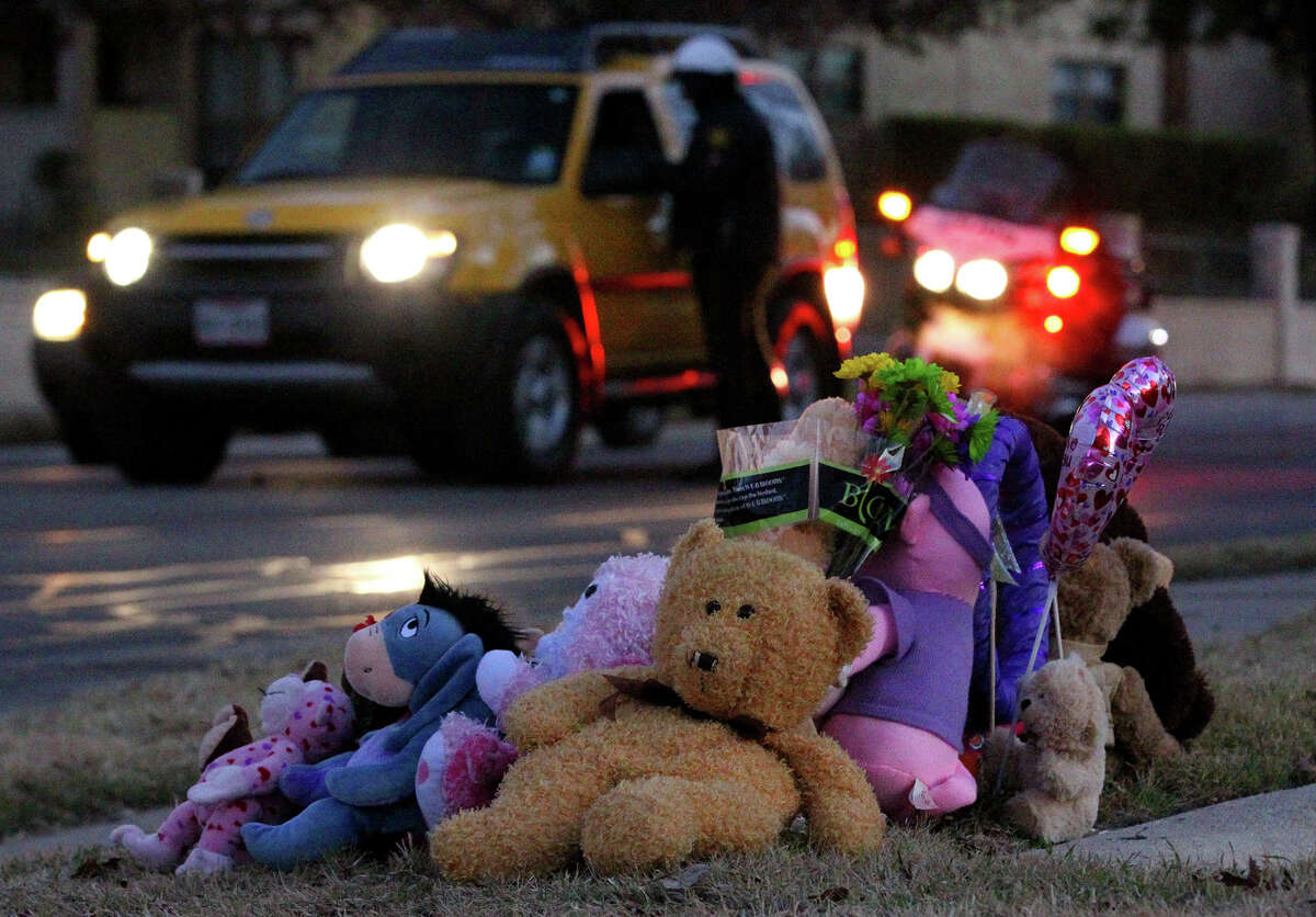 Stuffed animals, flowers and a balloon mark the area Thursday morning on the 11,700 block of Braesview where Tatyana Babineaux, 9, was killed while walking to school yesterday Wednesday January 15, 2014 during a hit-and-run accident. San Antonio police were pulling motorists over in the area near a school zone there.
