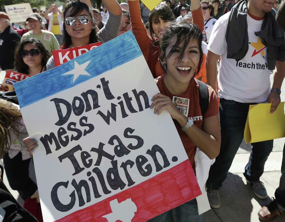 Teachers, students, parents and school administrators take part in a rally for Texas public schools at the state Capitol last year.