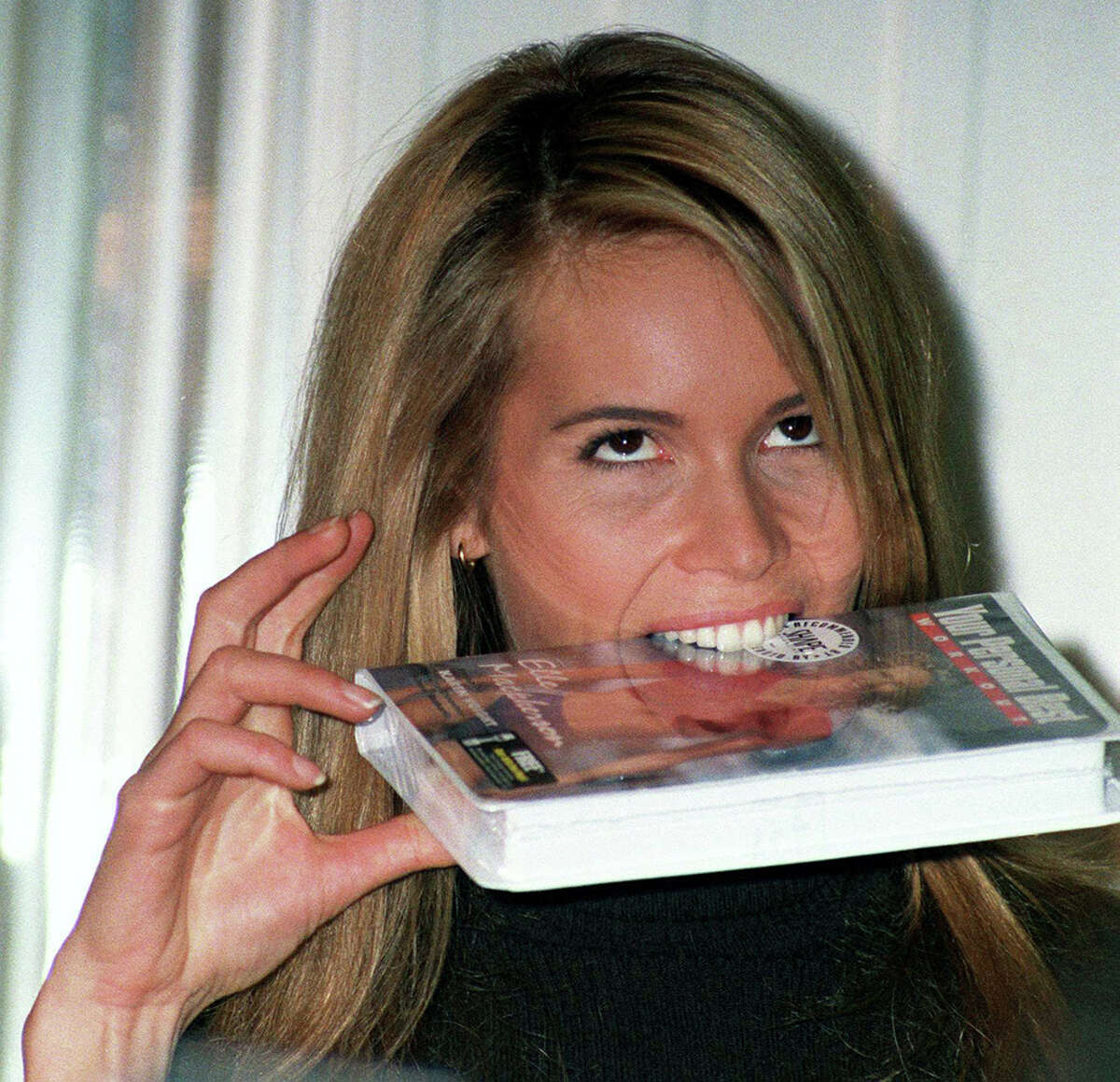 Elle has the right idea: maybe our old tapes can be used as a food source.PHOTO: Australian supermodel Elle Macpherson biting on a VHS copy of her fitness video "Your Personal Best," circa 1995.
