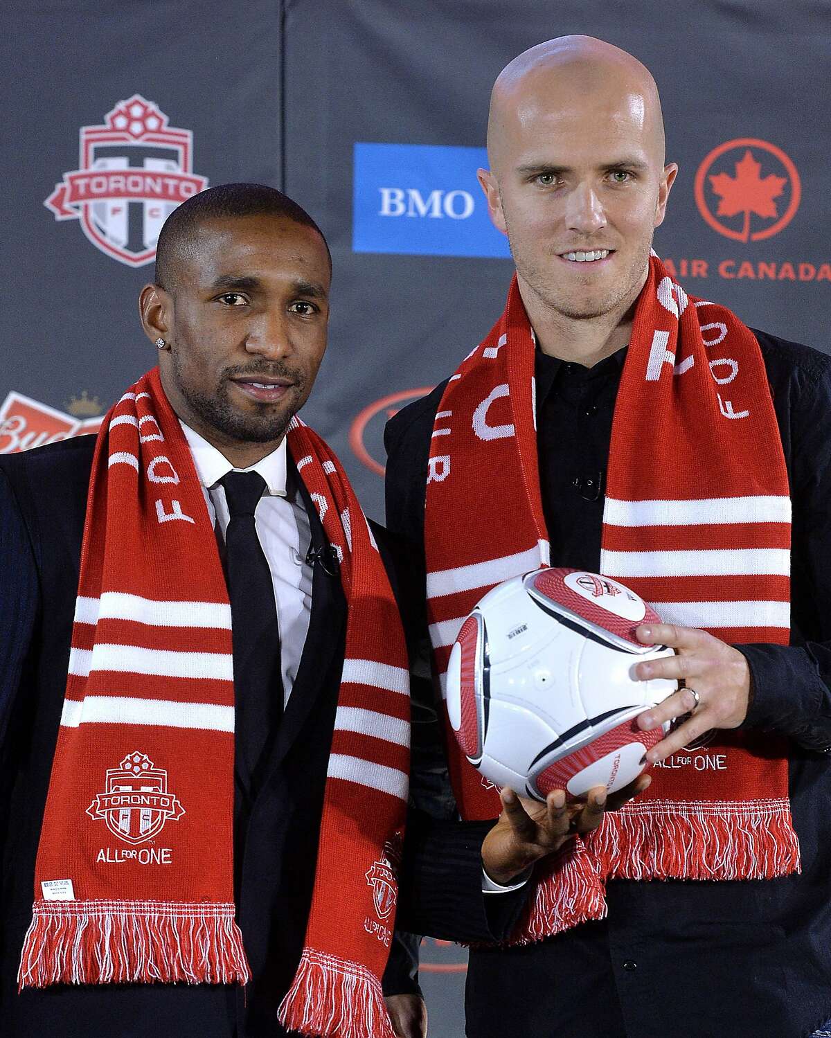 TORONTO, ON - JANUARY 13: Jermain Defoe (L) and Michael Bradley attend a press conference where they were introduced by Toronto FC at Real Sports Bar & Grill on January 13, 2014 in Toronto, Canada. (Photo by Jag Gundu/Getty Images)
