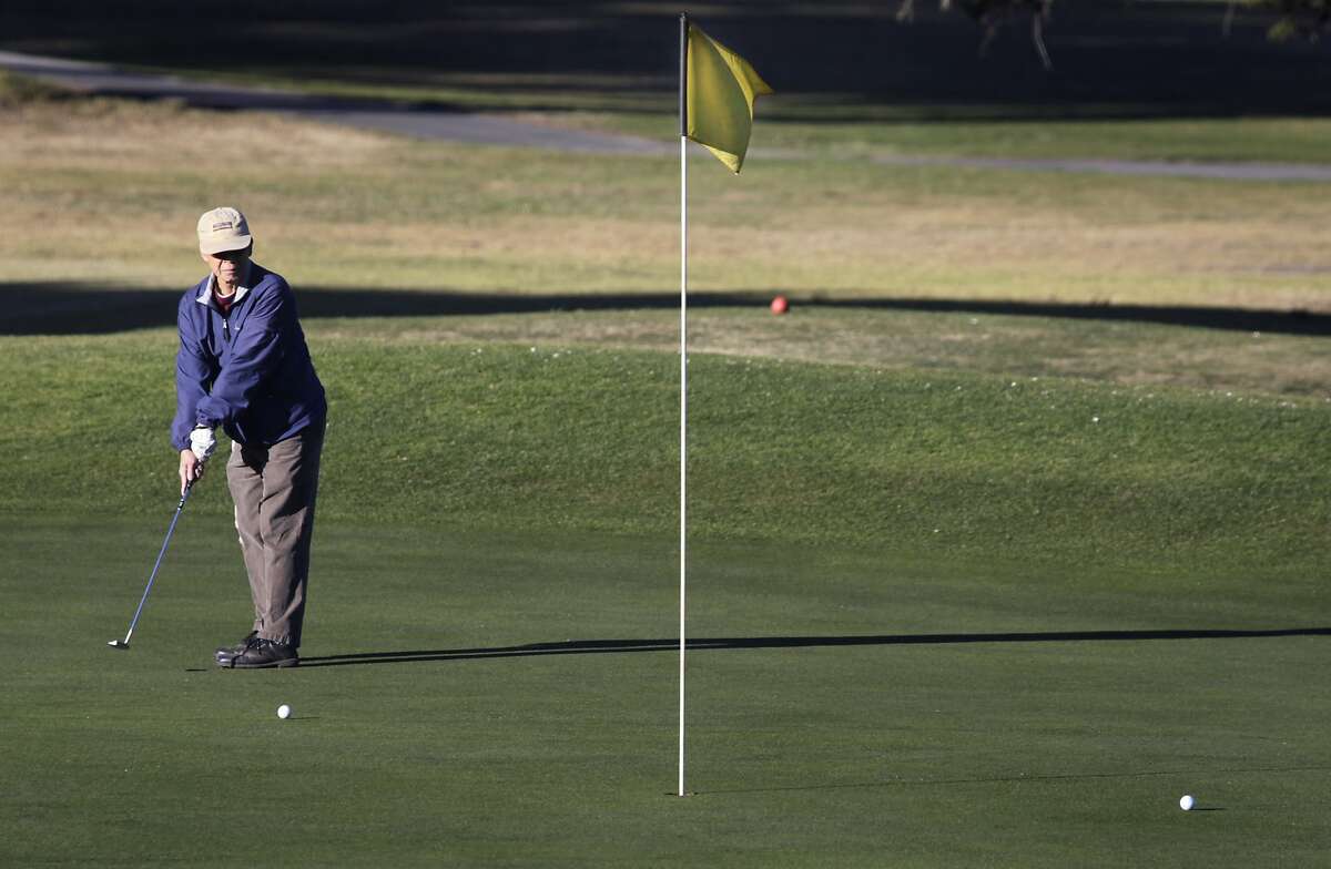 A golfer putts on the 10th green at Sharp Park Golf Course in Pacifica, Calif. on Thursday, Jan. 16, 2014. Proposed improvements to a pump house and a cart path at the San Francisco city owned course worry environmentalists.