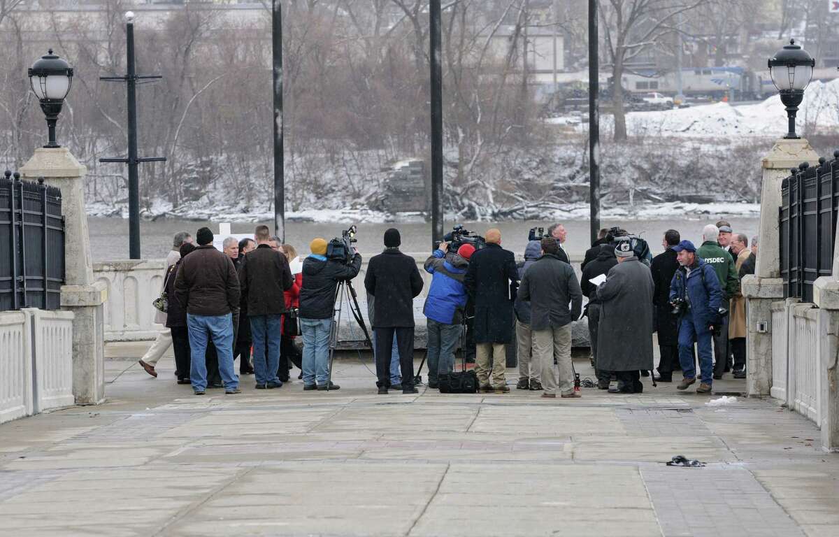 Members of the press gather on the Corning Preserve walkway for an announcement by State Department of Environmental Conservation Commissioner Joe Martens on $136 Million in upgrades to improve Hudson River water quality on Thursday, Jan. 16, 2014 in Albany, N.Y. (Lori Van Buren / Times Union)