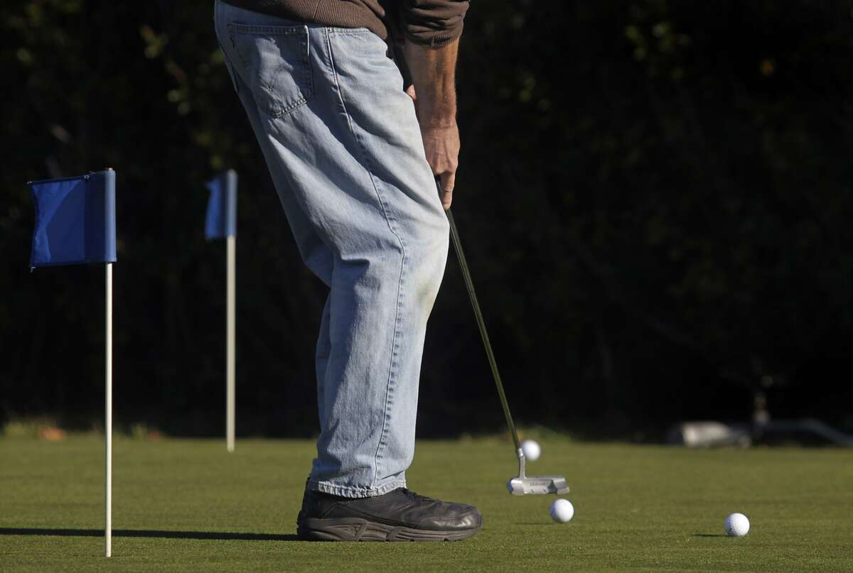 A golfer practice putts before a round at Sharp Park Golf Course in Pacifica, Calif. on Thursday, Jan. 16, 2014. Proposed improvements to a pump house and a cart path at the San Francisco city owned course worry environmentalists.