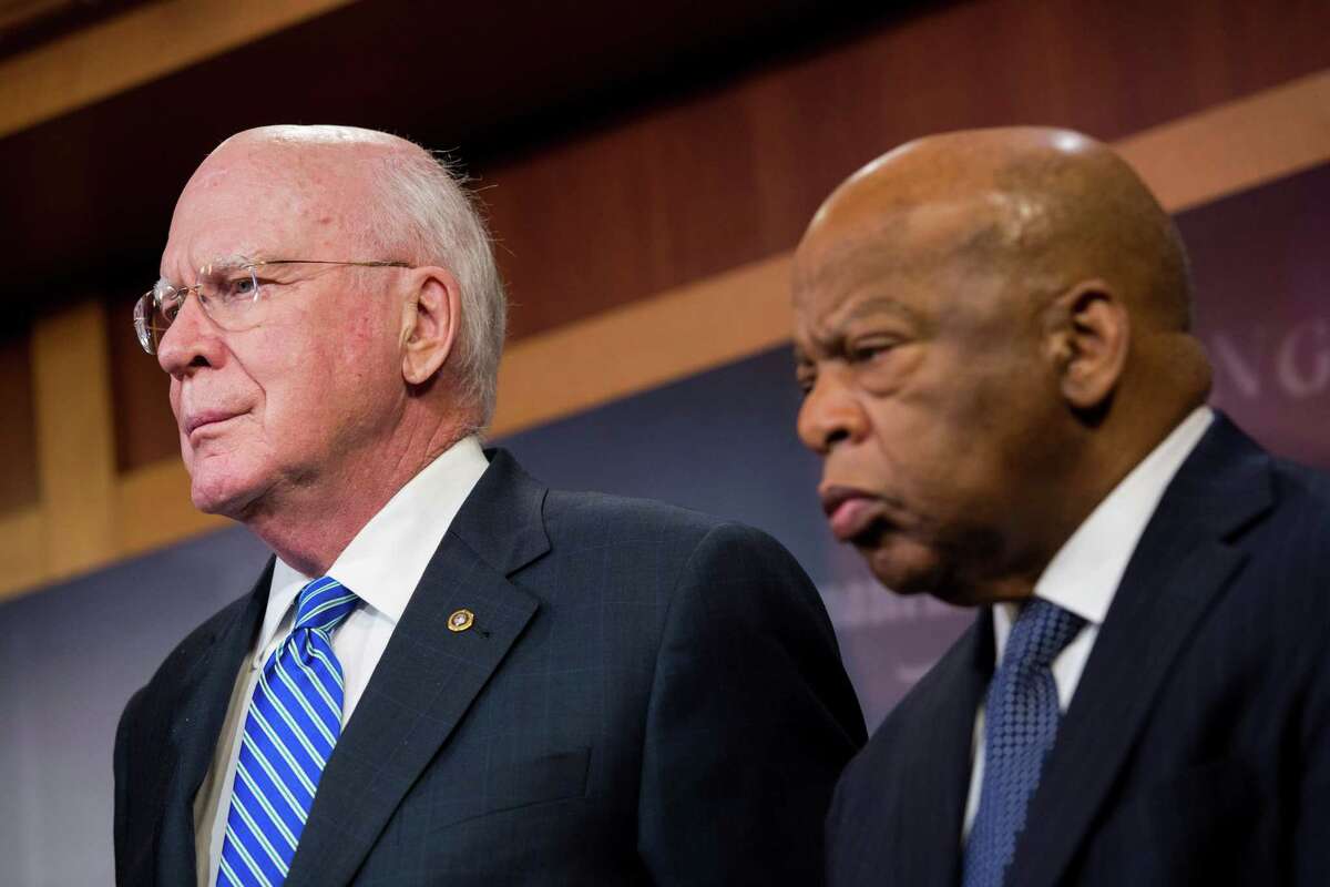 Rep. John Lewis, right, said Thursday that it was "amazing ... that we were able to come together so quickly." He is shown with Sen. Patrick Leahy.