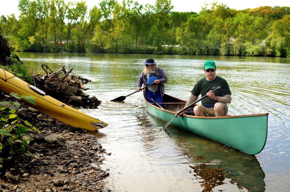 HVA's Nic Osborne, left, and Aquarion's John Herlihy, head out from O'Sullivan's Island in Derby on the last day of Housatonic Valley Association's ìSource to Soundî 10-day river trip Thursday, May 12, 2011.