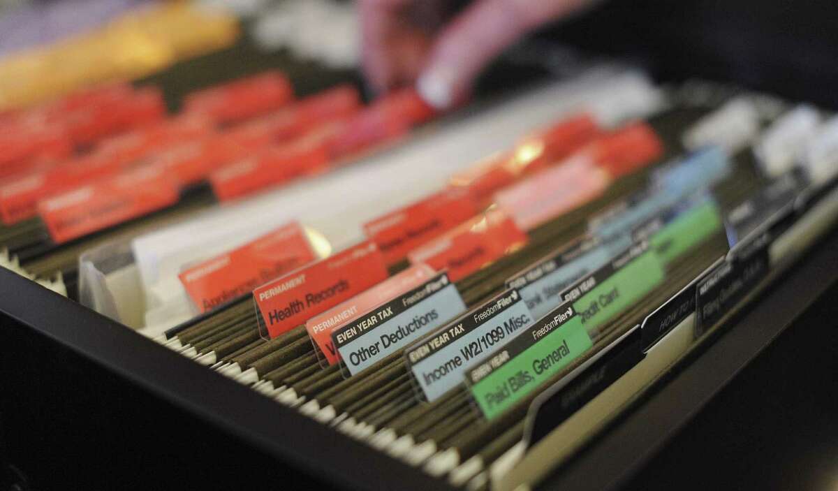 A filing system is a great way to organize records and other important documents.