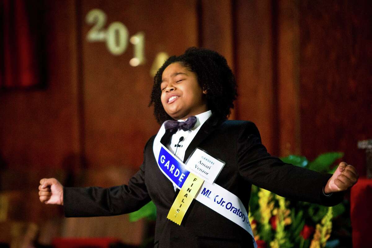 Winner Amari Venzor , 10, gives a speech paying tribute to the 50th anniversary of the civil rights leader's iconic "I Have a Dream" speech by Dr. Martin Luther King Jr. winning first place at the at the 18th Annual Gardere MLK Jr. Oratory Competition, Friday, Jan. 17, 2014, in Houston. Venzor who is a fifth grade student at Cornelius Elementary School spoke about the importance of education, " your education is the key to open the door of your opportunities" he said.