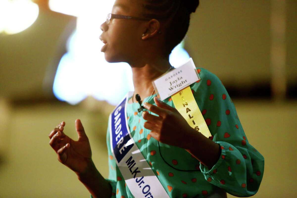 Jayla Wright delivers her speech as a tribute to Dr. Martin Luther King Jr. during the 18th Annual Gardere MLK Jr. Oratory Competition, Friday, Jan. 17, 2014, in Houston. Wright is a fifth grade student at Burrus Elementary School.